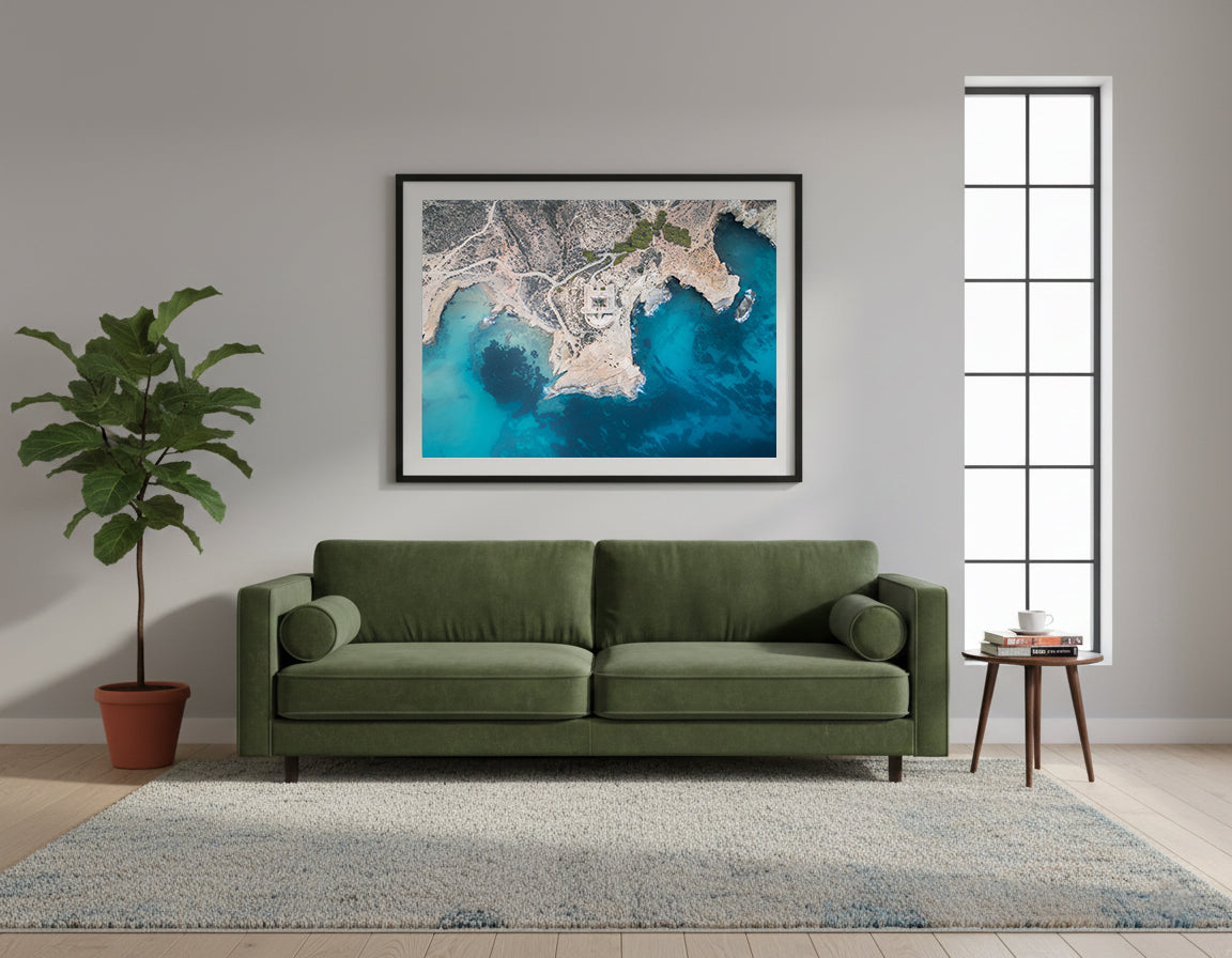 Framed aerial view of a coastal landscape with a castle surrounded by turquoise waters, in Cabo de Gata, Spain.