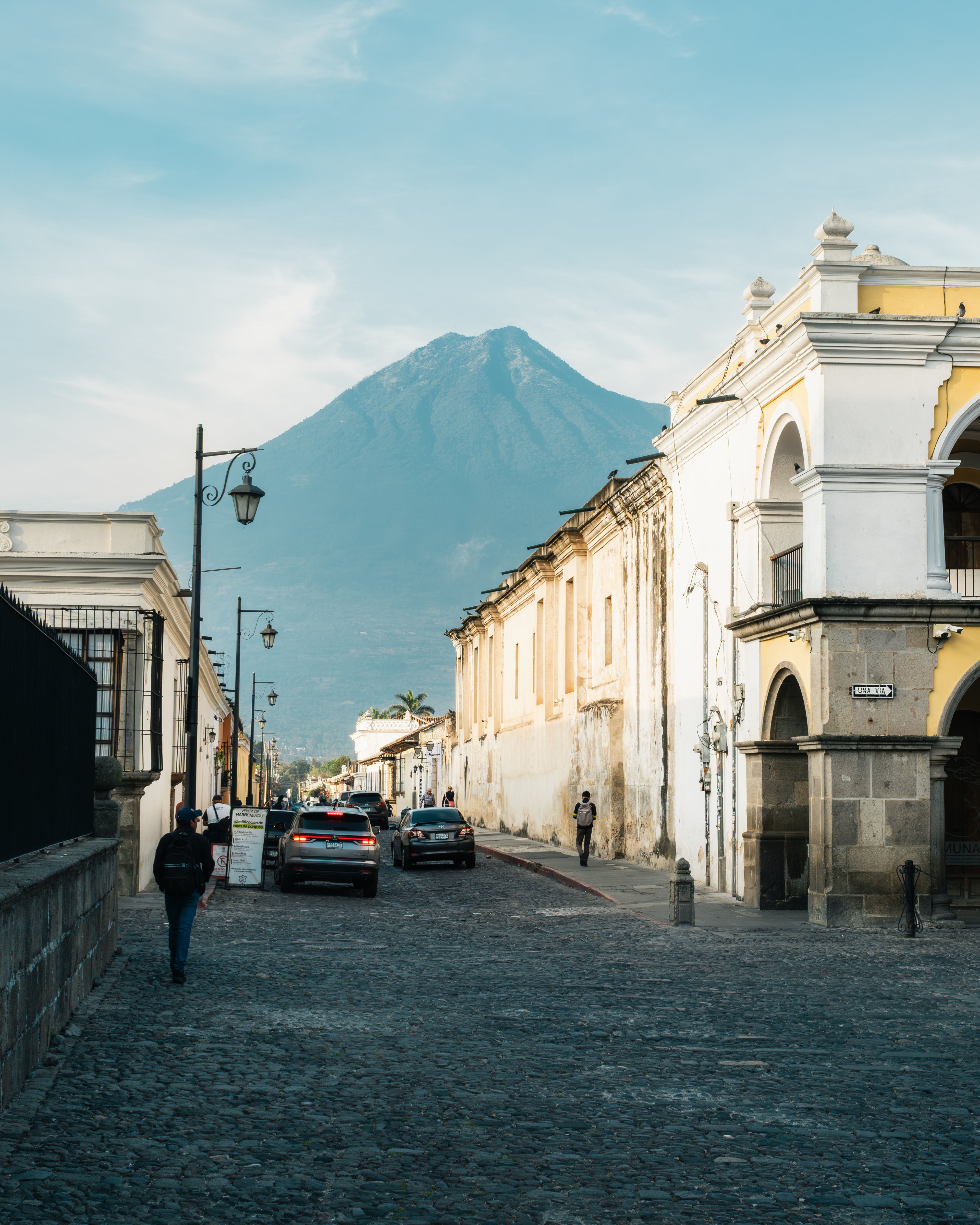 Street scene with historical buildings and a mountain in the background