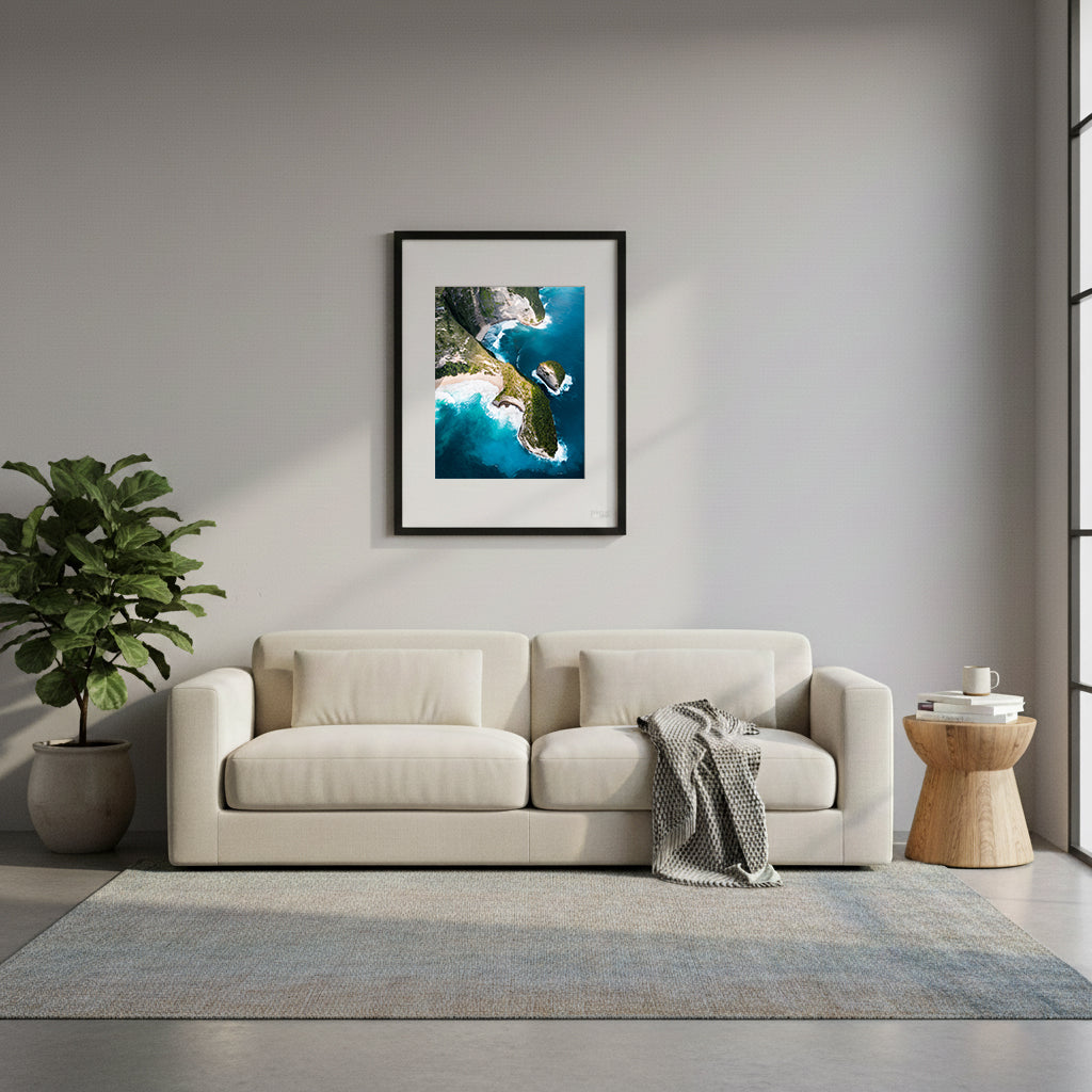 Framed aerial view of a tropical island with lush greenery and turquoise waters, Kellingking Beach, Bali, Indonesia.