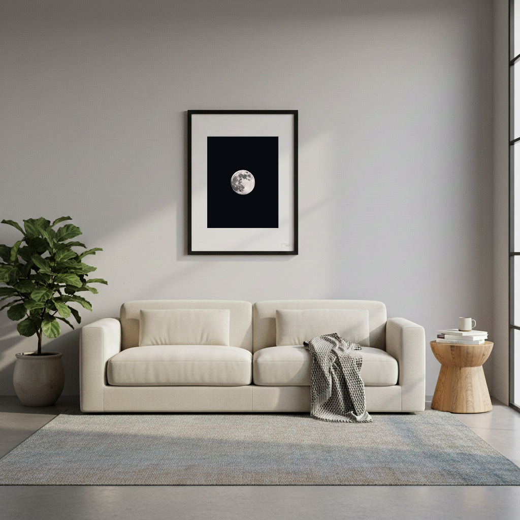 Framed, detailed full moon print against a black sky.