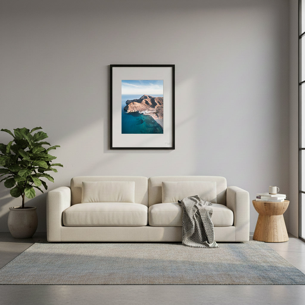 Framed mountains with rugged coastline and clear blue water, in Cabo de Gata, Spain.