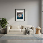 Framed rocky coastline with a fort-like structure surrounded by clear blue water, in Cabo de Gata, Spain.