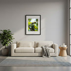 Framed emerald toucanet with yellow beak perched on a branch with a blurred green background, in Guatemala.